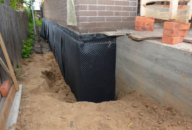 Happy homeowners after waterproofing job in Glyndon